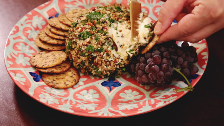 Putting cheese on cracker from Southern Cheese Ball 