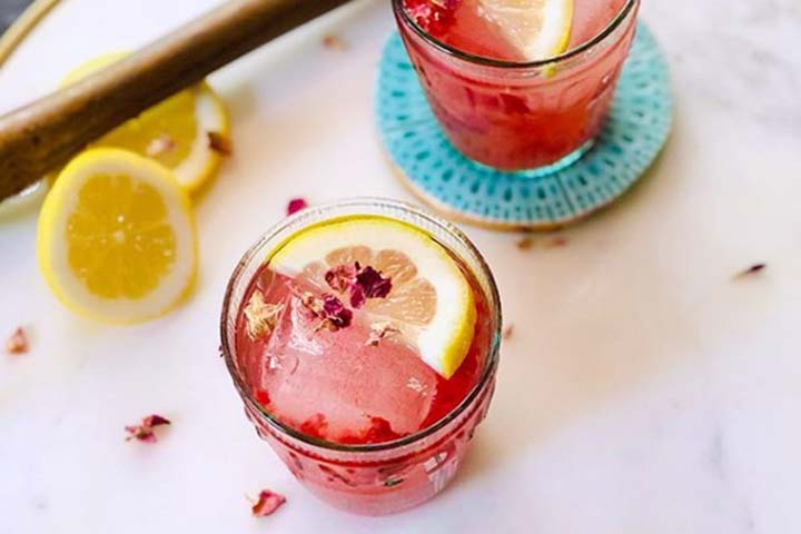 Raspberry Rose cocktails with wooden muddle