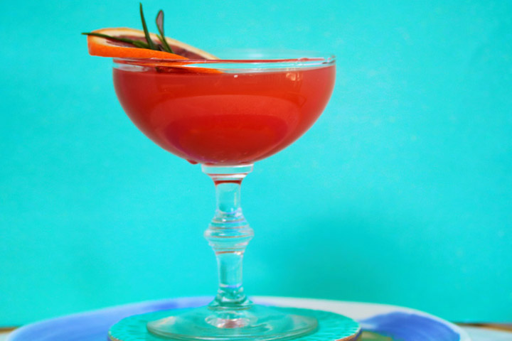 Blood Orange Rosemary Martini served in coupe glass