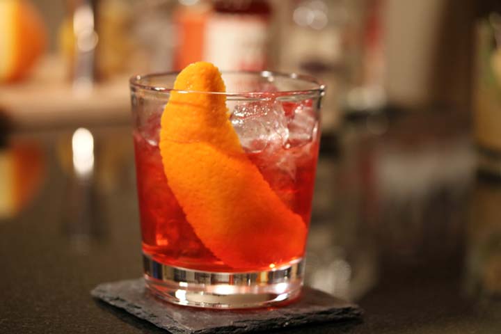 Cardinal cocktail with orange peel 
