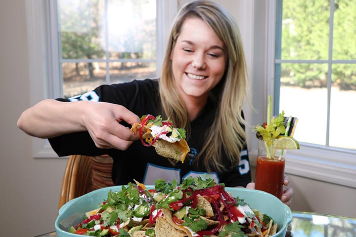 Elyse eating Epic Nachos