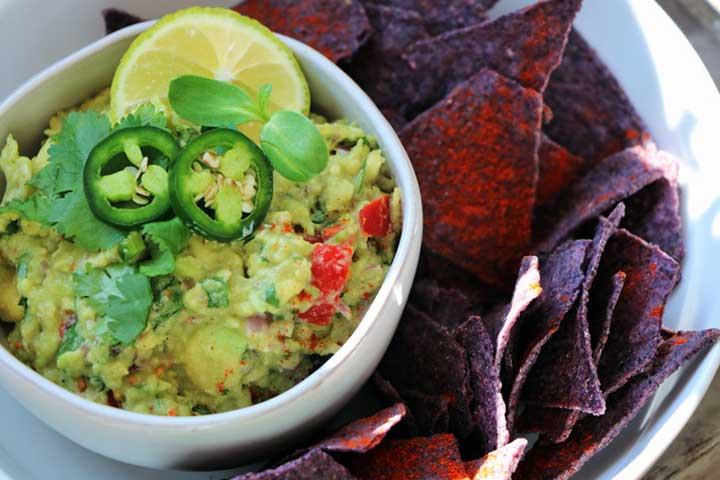 Platter of Guacamole verde with blue corn chips