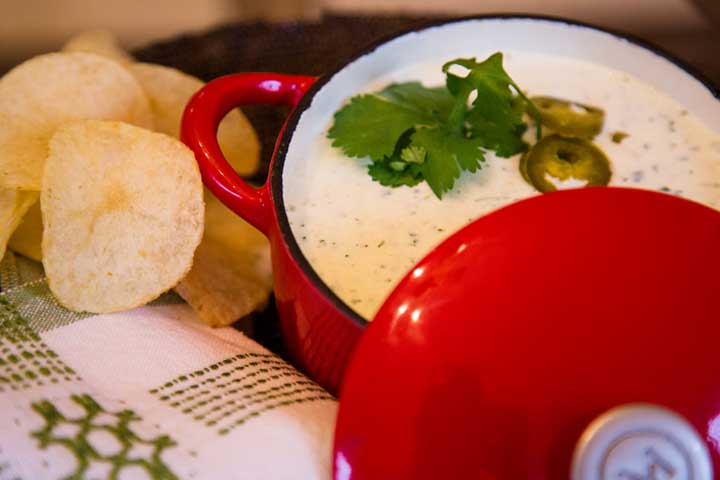 jalapeno sauce in crock with chips