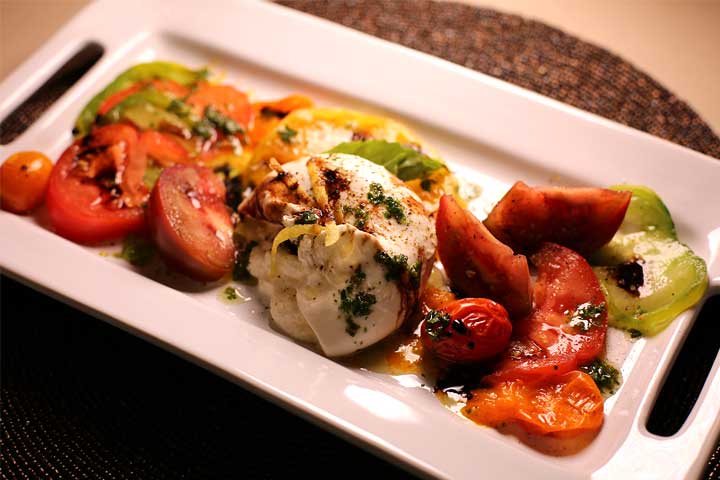 burrata heirloom salad presented on platter